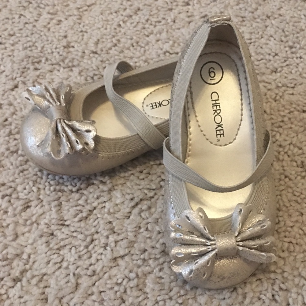 Gold ballet flats with flower detail